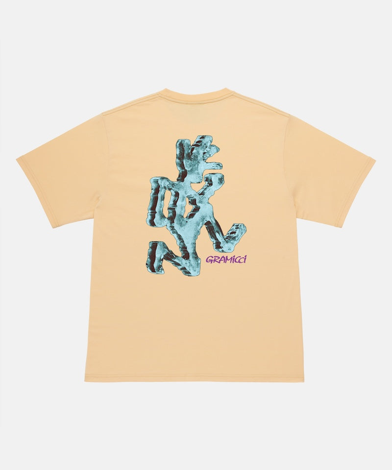 Back view of a Gramicci mango colored Ice Sculpture Tee with a running man graphic against a light tone background.