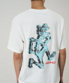 Back view of a model wearing a Gramicci white Ice Sculpture Tee with a running man graphic against a light tone background.