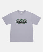Gramicci lavender Half Dome Tee with grey and green graphic against a light tone background.
