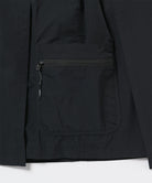 Close-up of Gramicci Guide Skort pocket in the color black against a light-tone background.