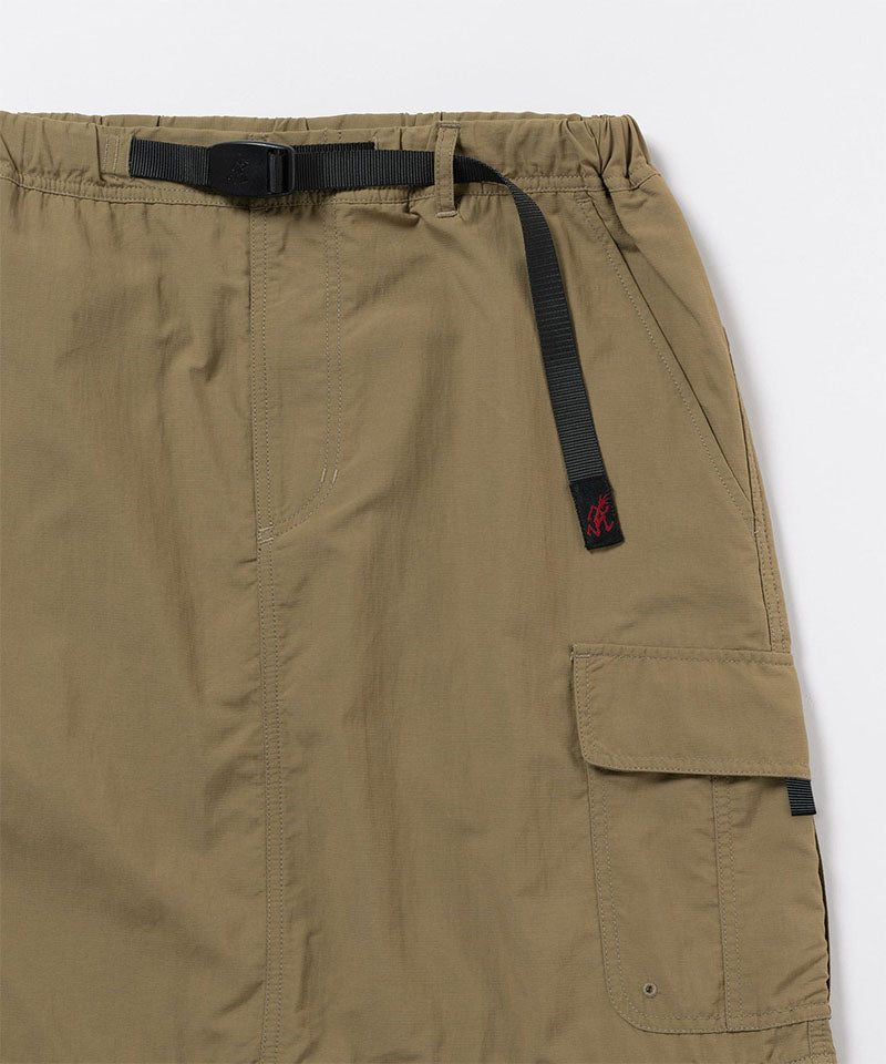 Close-up of Gramicci Convertible Cargo Skirt in the color khaki against a light-tone background.