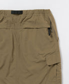 Back view close-up of Gramicci Convertible Cargo Skirt in the color khaki against a light-tone background.