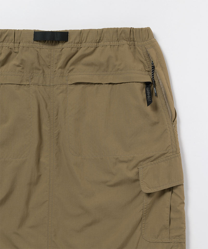 Back view close-up of Gramicci Convertible Cargo Skirt in the color khaki against a light-tone background.