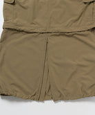 Close-up of Gramicci Convertible Cargo Skirt in the color khaki against a light-tone background.
