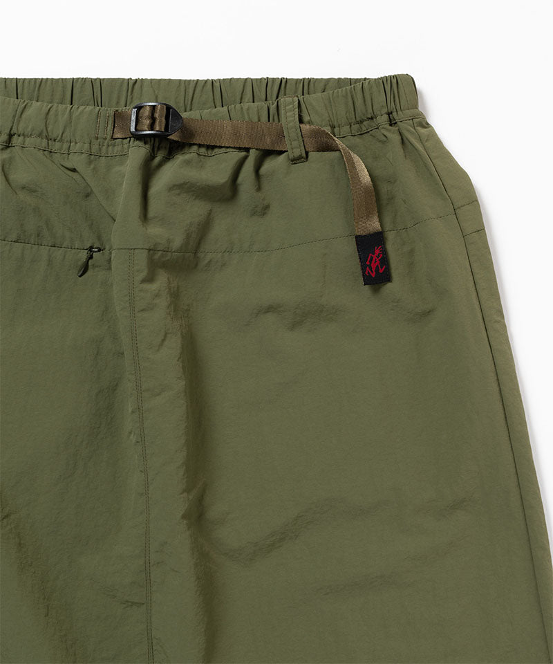 Green skirt with a belt and brand tag on a white background