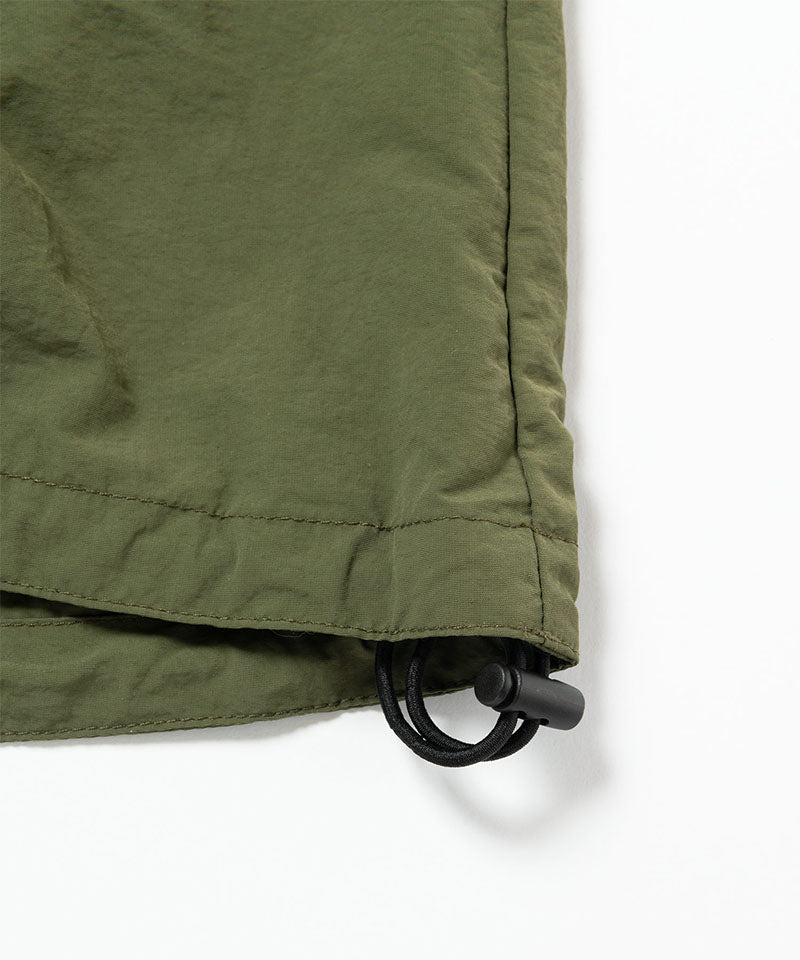 Close-up of a green skirt on a white background