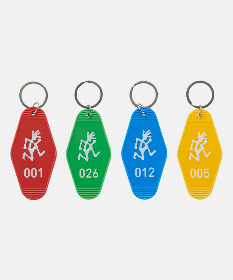 Four colorful Gramicci Hotel Keychains with numbers and a running man on a white background.