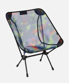 Bright camo Gramici &Helinox Chair One against a light-tone background.