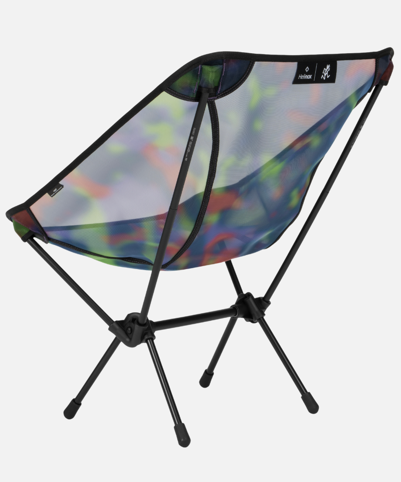 Bright camo Gramici &Helinox Chair One against a light-tone background.