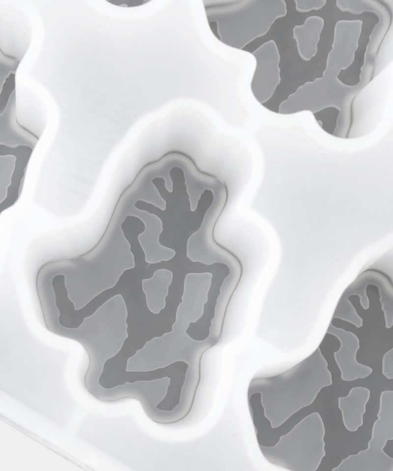 Silicone mold with gray silicone parts on a white background, branded 'Gramicci'.